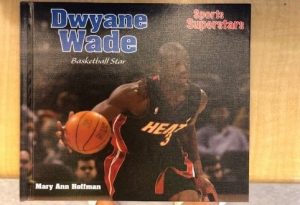 Book titled "Dwyane Wade Basketball Star" with a photo of Dwyane Wade on the cover