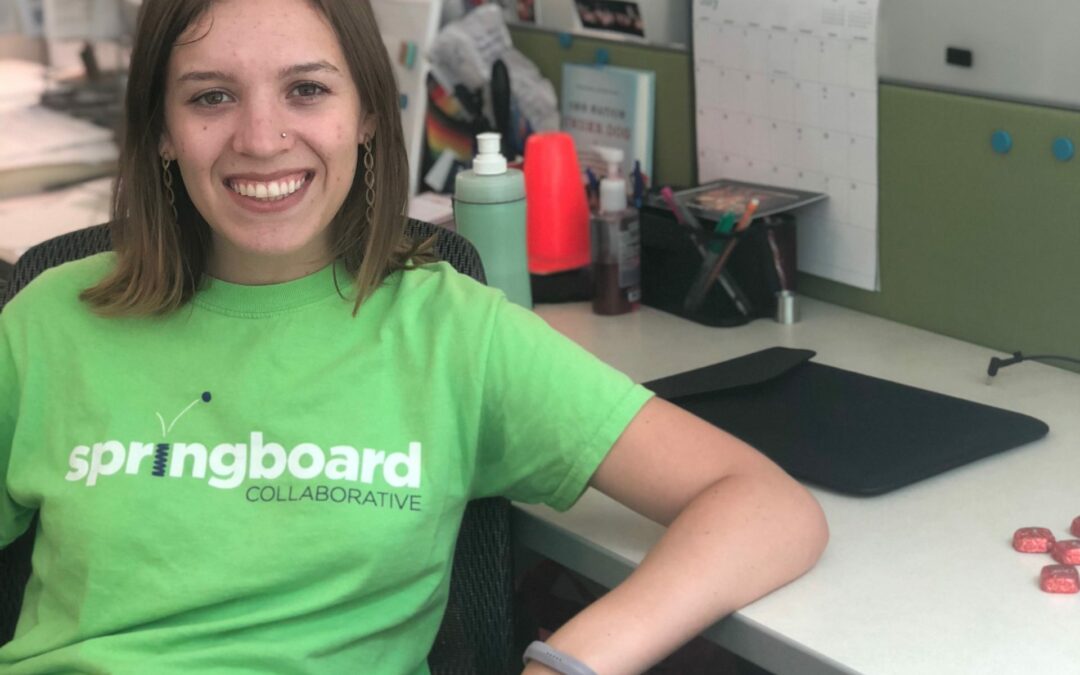 Alanna DiGioia, Executive Assistant at Springboard Collaborative, sitting at a Springboard Collaborative office desk