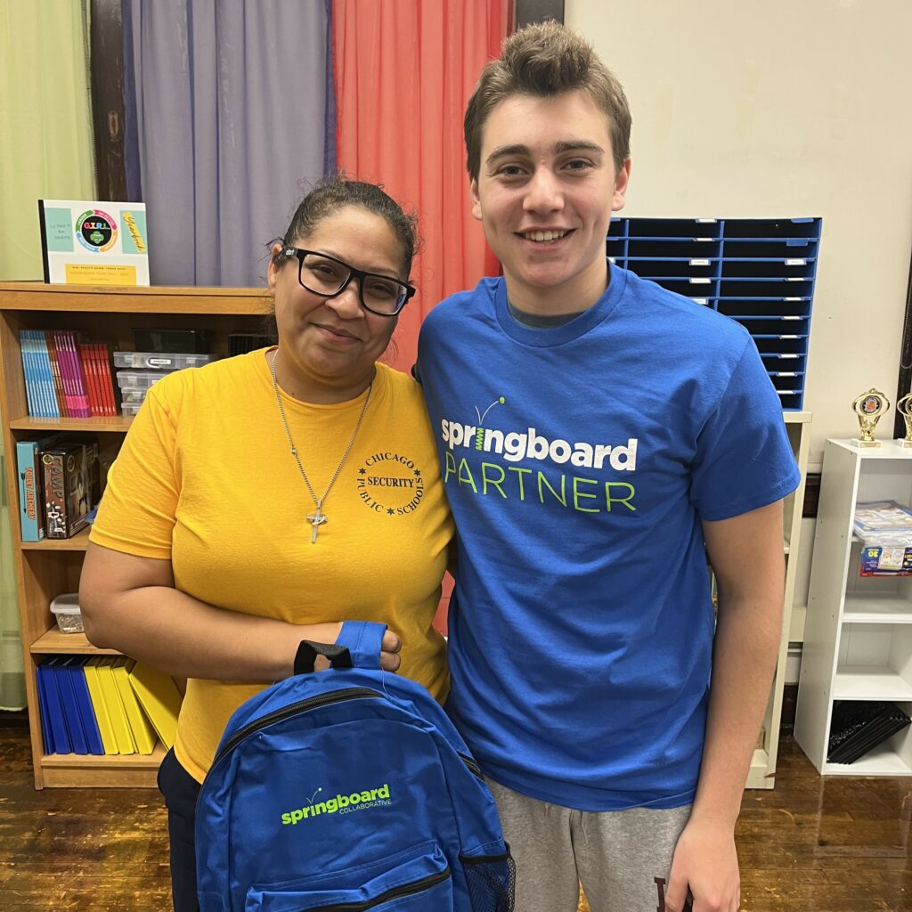 Educator Niurka Morales with her male student holding a backpack